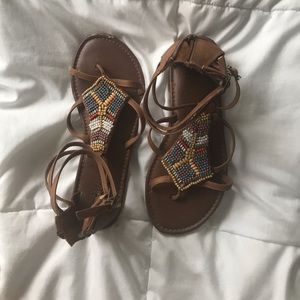 Beaded sandals.